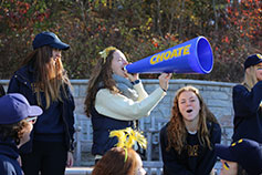 Photo of a student using a megaphone. Link to What to Give